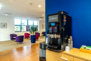 Comfortable patient lounge with refreshments at Care Fertility Cheshire, Daresbury Park — modern, relaxing space for fertility patients in Cheshire.