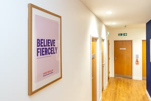 Hallway inside Care Fertility Cheshire clinic featuring Care Fertility branding and patient areas — Daresbury Park, Warrington.