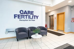 The reception area on the 1st floor of Care Fertility Nottingham, show here with comfortable seating in a bright lit room.
