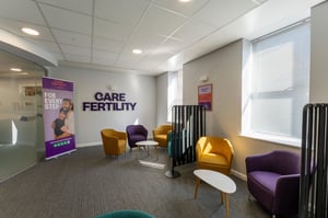 Care Fertility Leeds clinic waiting area with colourful armchairs and natural light from large windows.