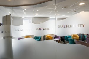 rosted glass meeting room panels displaying the Care Fertility branding inside the Leeds clinic.
