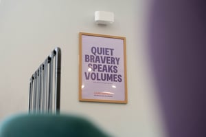 Framed “Quiet bravery speaks volumes” artwork displayed in a calming patient area at Care Fertility Leeds.