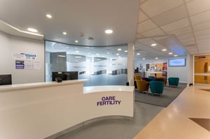 Reception desk and entrance area inside the Care Fertility Leeds clinic with welcoming open-plan design.