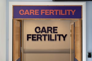 Close-up of the Care Fertility Leeds entrance signage above the clinic doorway.