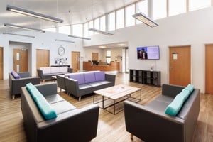 The reception and waiting area at Care Fertility Bath, with comfortable seating for patients.