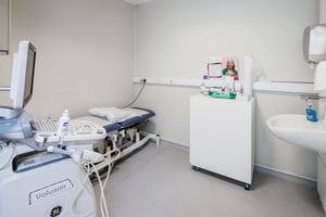 A treatment room at Care Fertility Bath, with a sink and fresh supplies ready for your visit.
