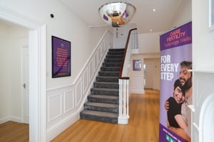 Hallway and carpeted staircase at Care Fertility Tunbridge Wells