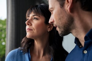 Man and woman looking pensive
