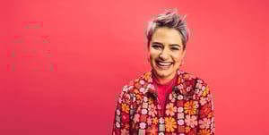Short haired woman pink background