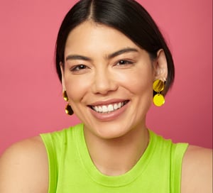 Smiling woman pink background