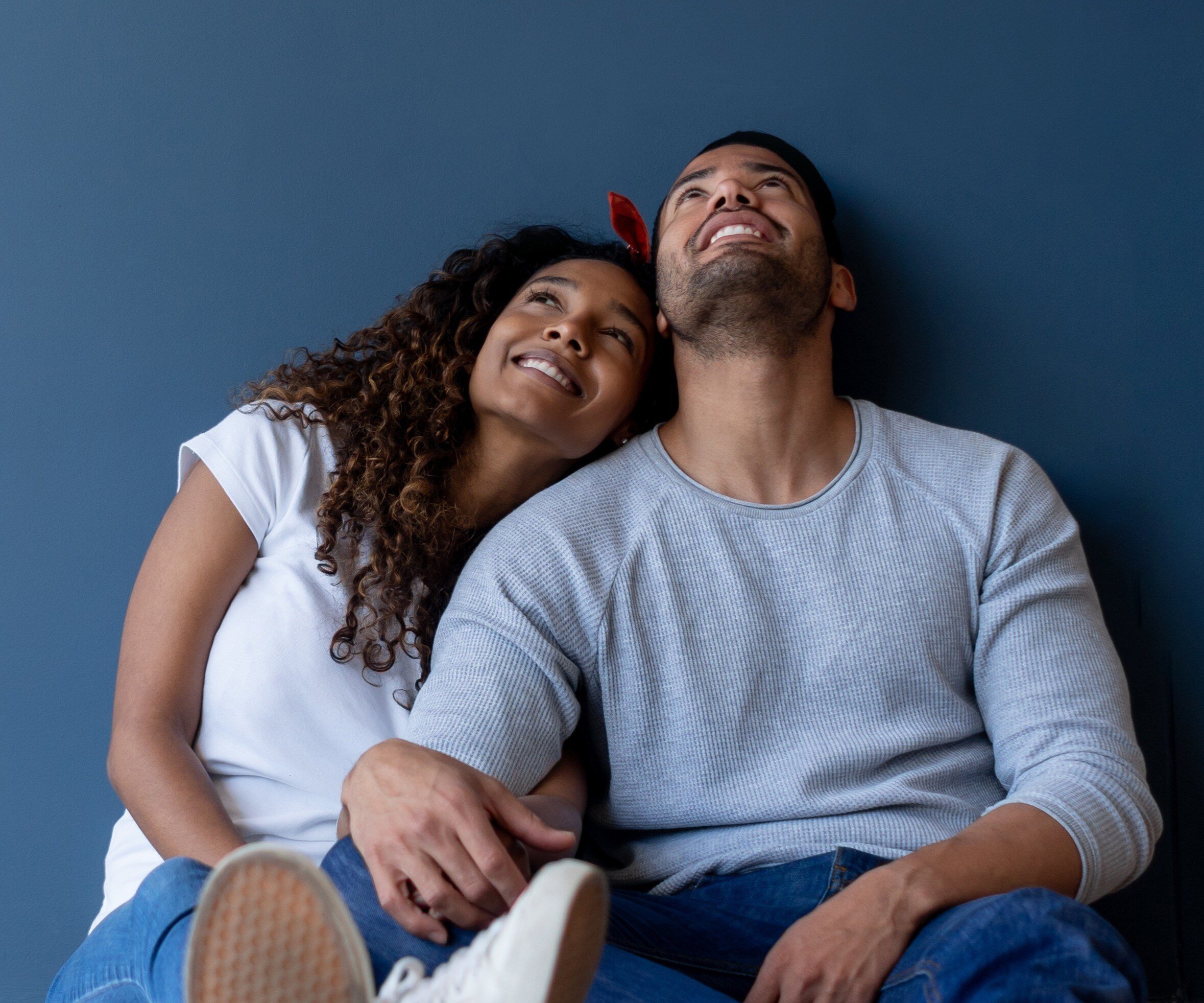 Couple in front of blue background